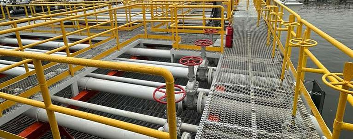 Yellow handrails over process pipelines